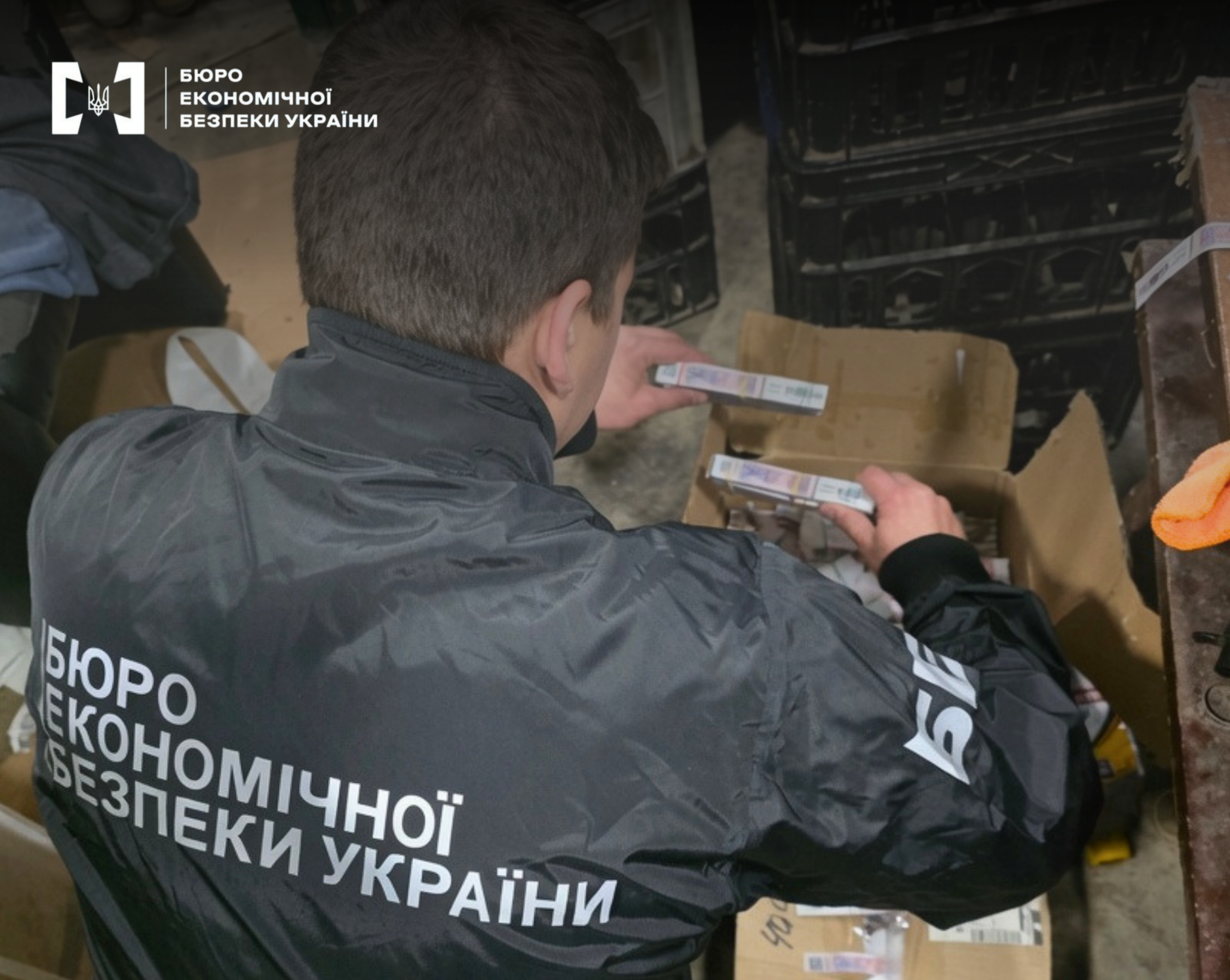 A ESBU detective from the back counts seized cartons of counterfeit cigarettes.