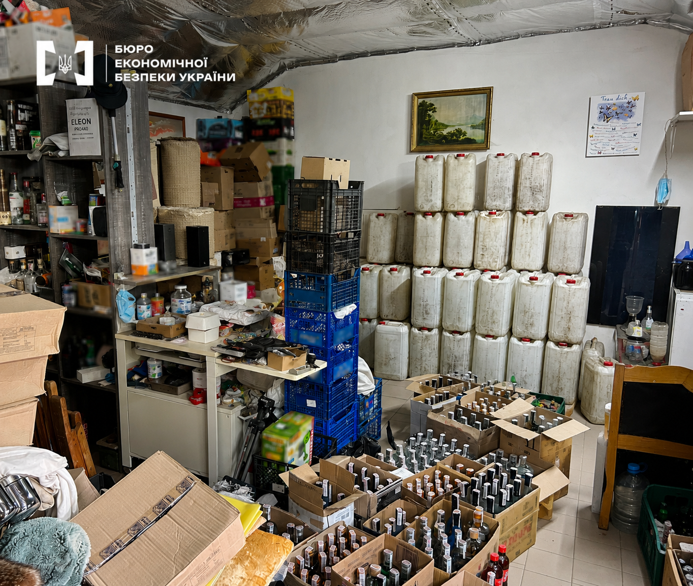 Cluttered warehouse with dozens of canisters and boxes of alcohol