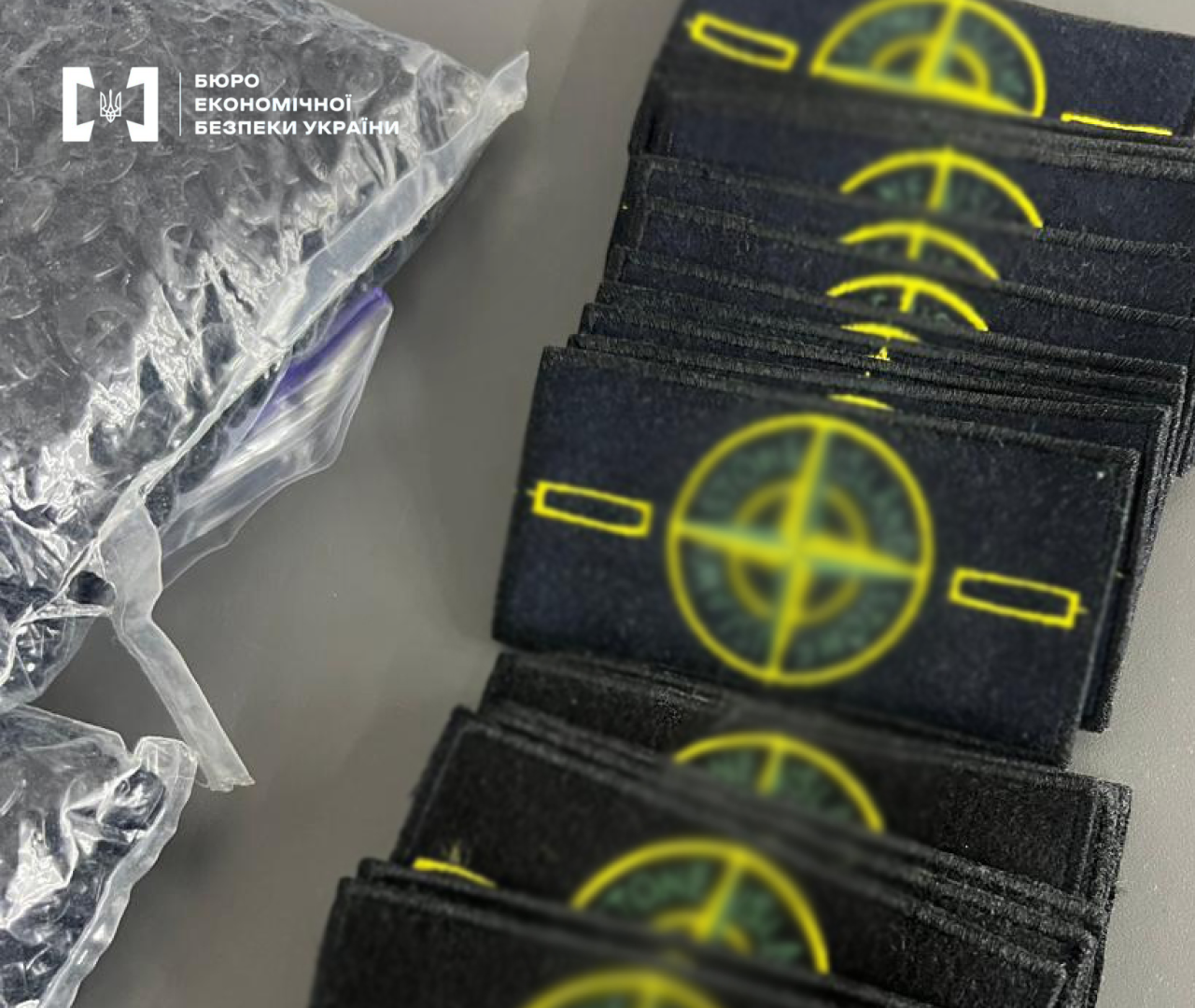 A batch of counterfeit chevron patches of the famous global clothing brand Stone Island, which were illegally manufactured in a sewing workshop.