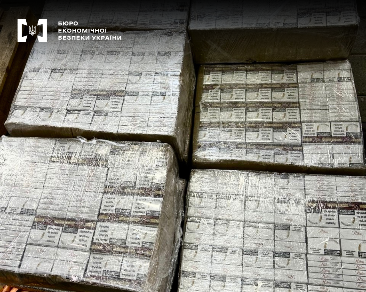 Large pallets with packs of Ritm cigarettes wrapped in film, featuring health warnings in the Romanian language.