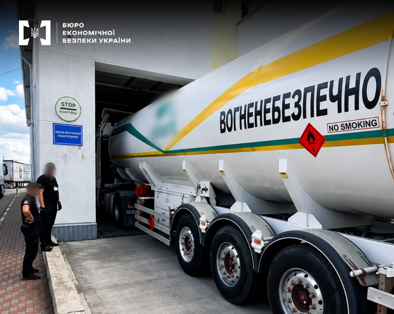 A large white tank trailer with the inscription