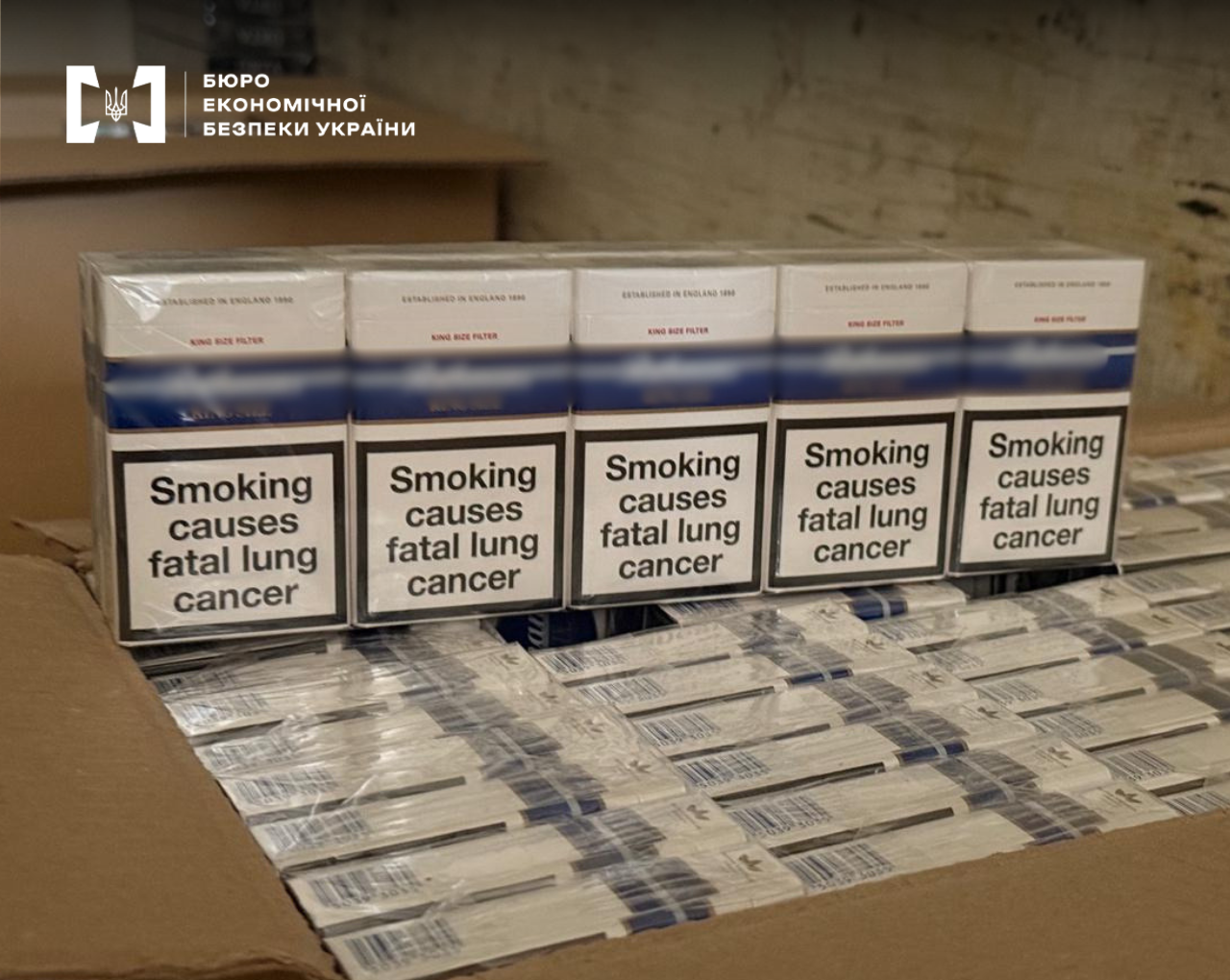 A row of cigarette packs with the English medical warning 'Smoking causes fatal lung cancer'