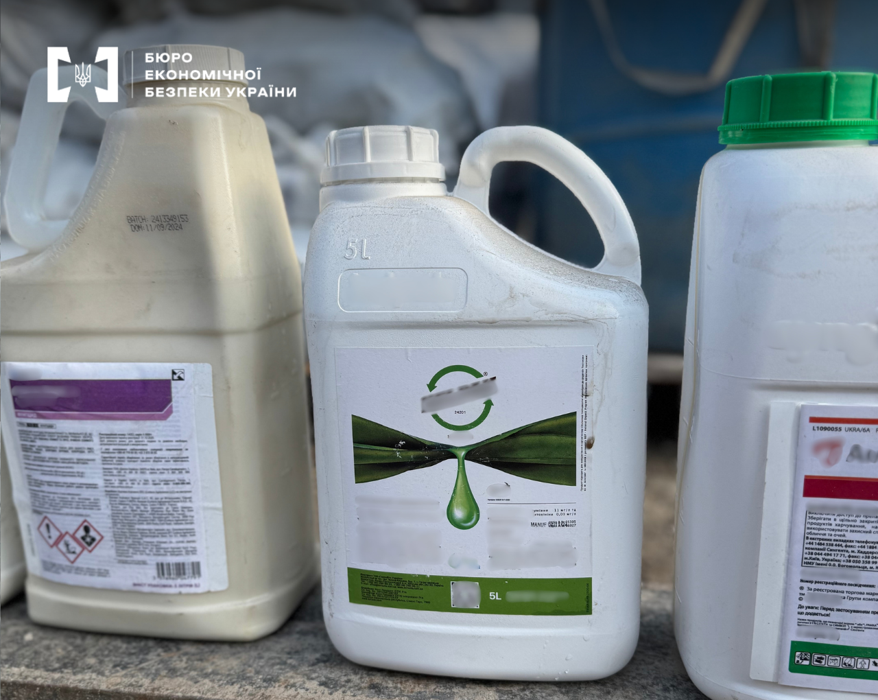 Plastic canisters with a capacity of 5 liters with blurred labels of plant protection products