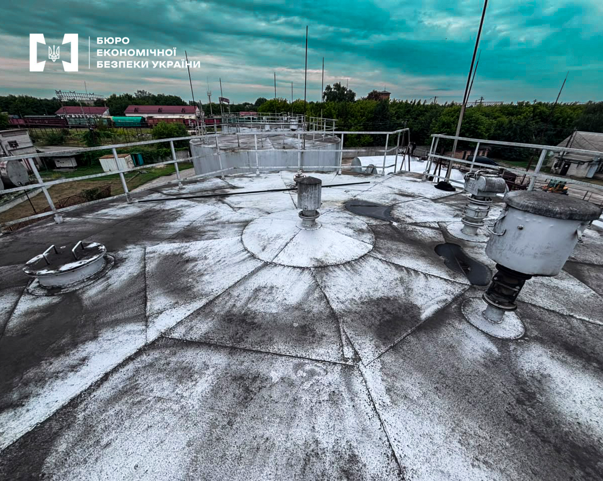A top view of large metal tanks of an industrial enterprise.