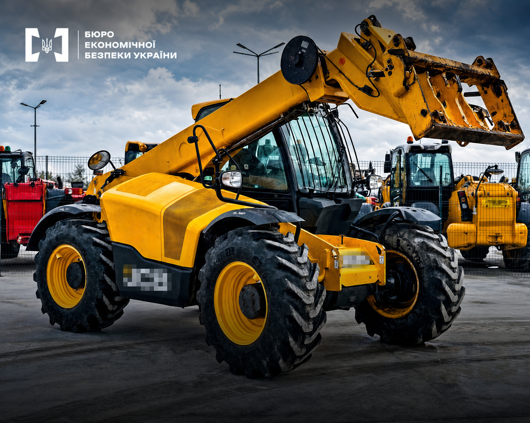 A yellow JCB telehandler on a site with other equipment.